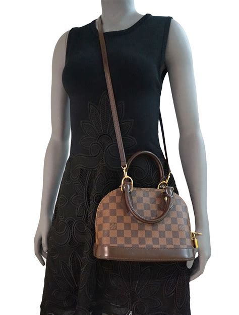 alma bb louis vuitton on person